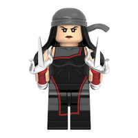 Superhero Elektra brick minifigure on white background